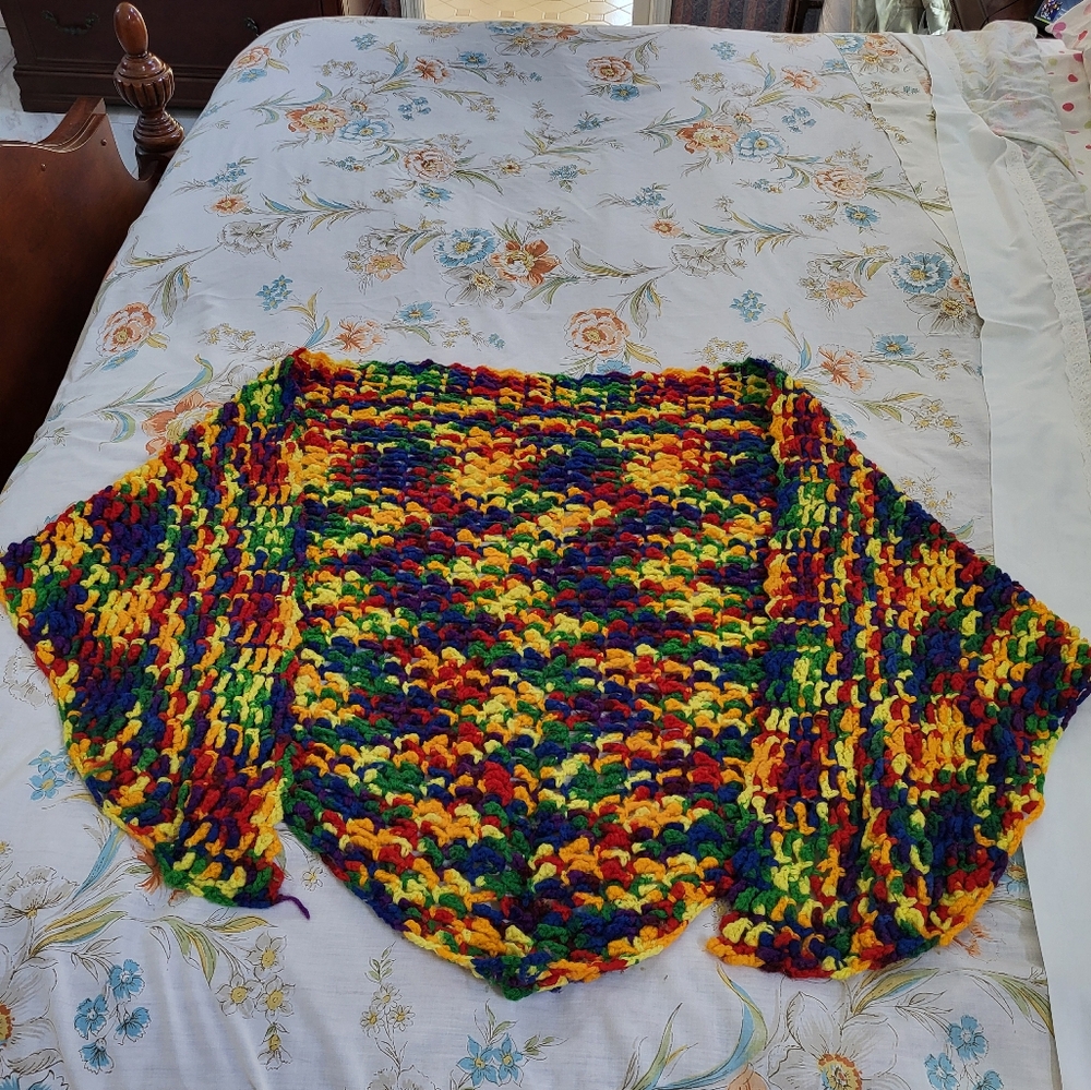 Rainbow colored knit shawl